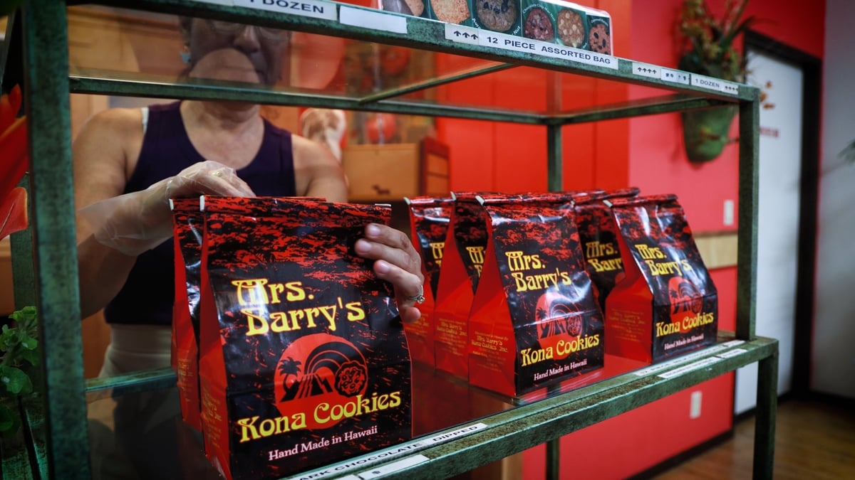 Person placing cookie bag on shelf